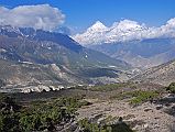 11 Dhaulagiri And Tukuche Peak Early Morning On Trail To Mesokanto La I turned around on the trail towards Mesokanto La and watched the clouds boil up towards Dhaulagiri and Tukuche Peak. The trail continues up the side of the valley from the kharka (3460m) and then splits in two � the left going to the Tilicho eastern pass (5200m), while we took the right path to try and cross the Mesokanto La (5100m).